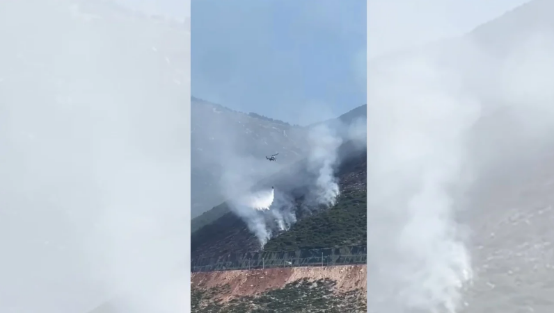 Zjarret në jugun e Shqipërisë/ Era dhe temperaturat favorizojnë përhapjen e flakëve, ndërhyn helikopteri